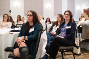 Women attending a session at the #FollowFriday Conference